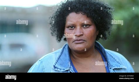 African woman close-up face, hispanic Brazilian ethnicity, serious ...