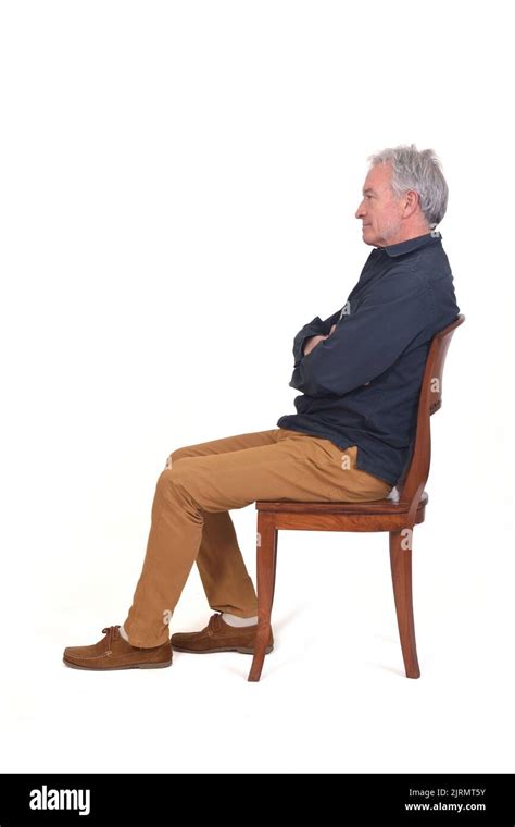 Side View Of A Man Sitting On Chair On White Background Stock Photo Alamy