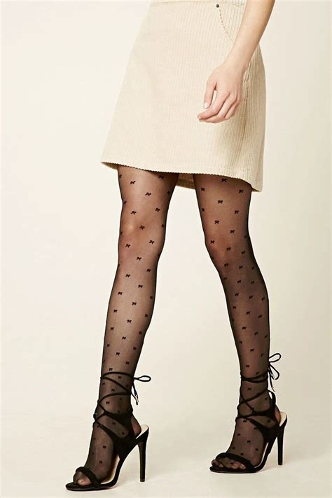 A Pair Of Semi Sheer Tights Featuring An Allover Bow Print And Elasticized Waist Sheer Tights