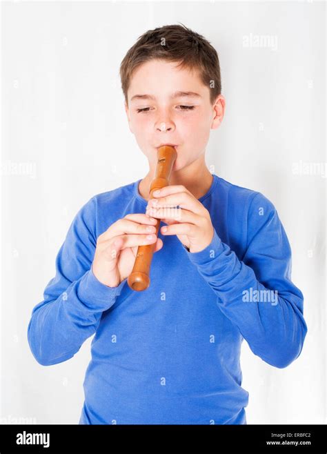 Young Boy Playing On A Flute Stock Photo Alamy