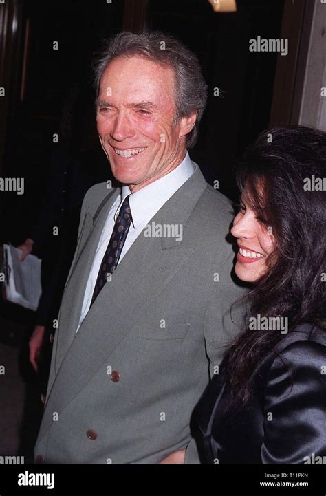 Los Angeles, CA, USA 04 February 1997: Actor CLINT EASTWOOD & wife DINA RUIZ at the premiere of ...