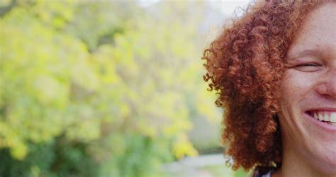 Half Portrait Of Happy Biracial Man With Curly Red Hair Smiling In