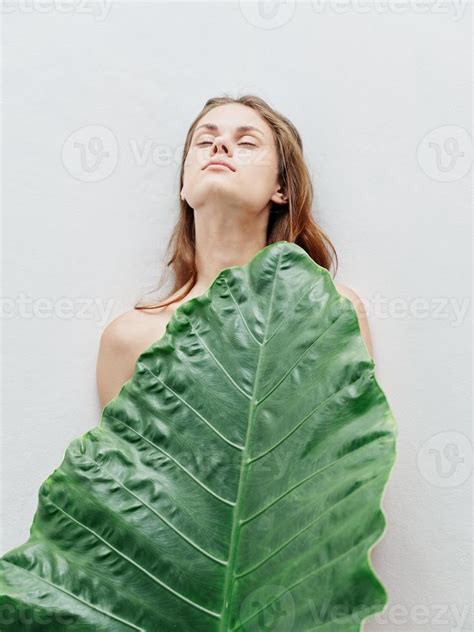 Woman With Closed Eyes Nude Body Green Palm Leaf Light Background 22065698 Stock Photo At Vecteezy