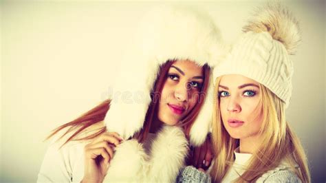 Two Women with Winter Clothes Stock Photo - Image of cold, warm: 139176698