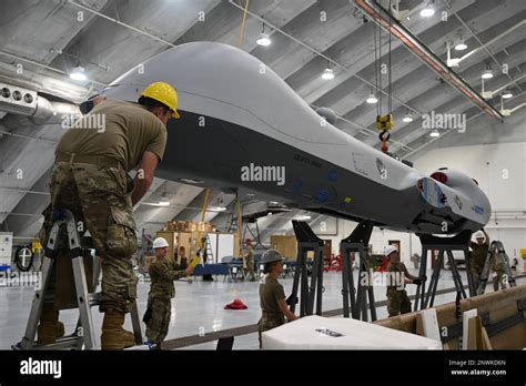 A U S Air Force Aircraft Maintainer Assigned To The Th Wing Assists