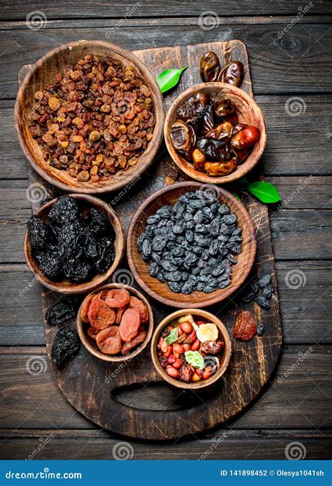 Assortment Of Different Kinds Of Dried Fruits In Bowls Stock Photo