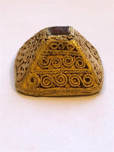 Detectorist shares "find of a lifetime" 1,200-year-old gold scabbard mount