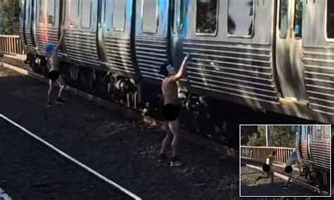 Nude Vandals Caught Spray Painting A Melbourne Train Daily Mail Online