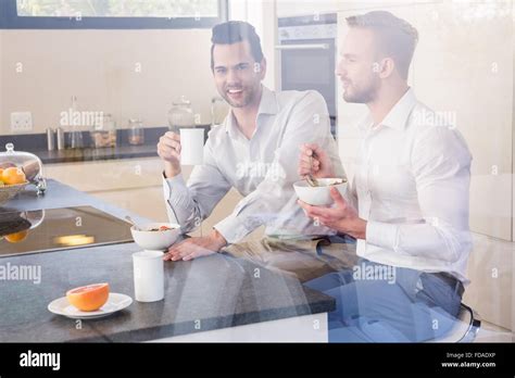 Smiling Gay Couple Having Breakfast Stock Photo Alamy