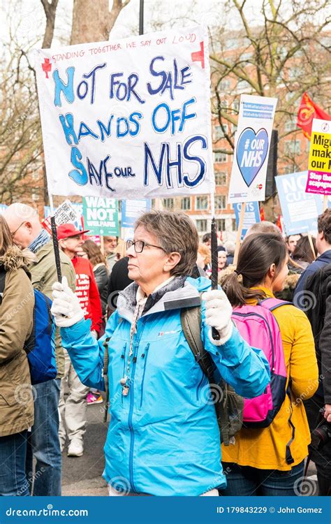 Protester With Placard Banner At The Save Our NHS Protest Demonstration