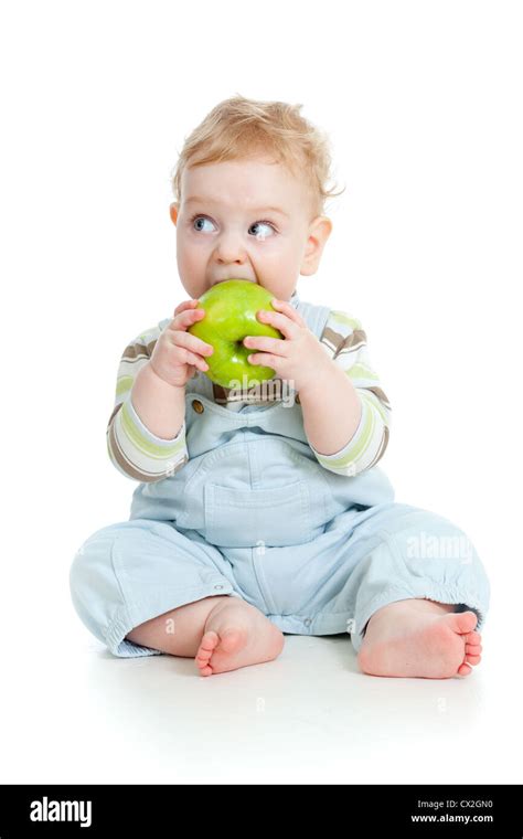 Baby boy eating healthy food isolated Stock Photo - Alamy