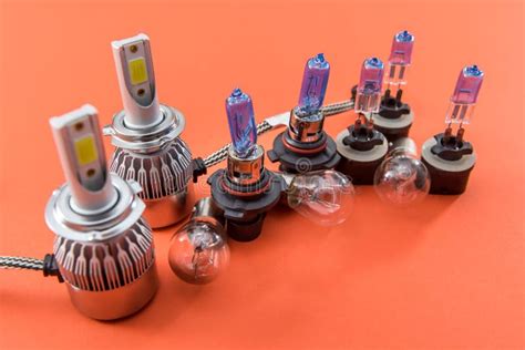 Different Shapes and Sizes Car Light Bulbs Isolated on Orange. Modern Auto Glass Lamp Stock ...