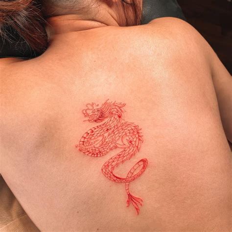 Fine Line Red Dragon Tattooed On The Back