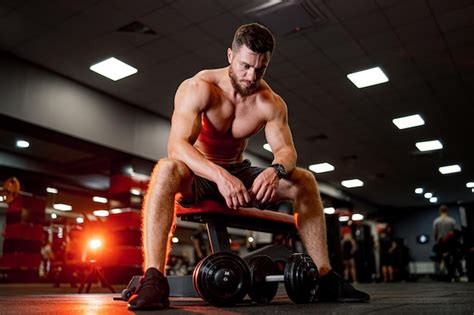 Premium Photo Muscular Man With Naked Torso Training His Body Hard Working Bodybuilding Man In Gym