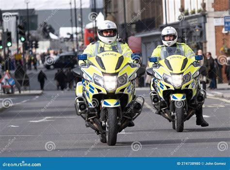 British Traffic Cops On Patrol Through Central London England