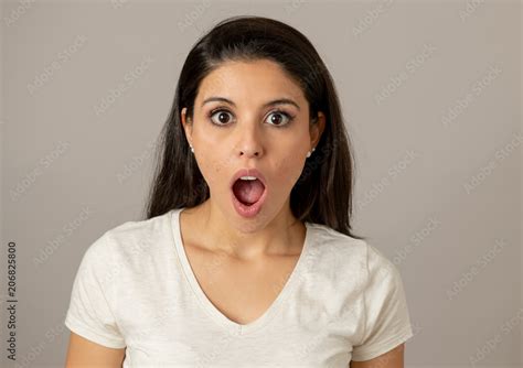 Young Attractive Woman With A Surprised And Shocked Face Eyes And