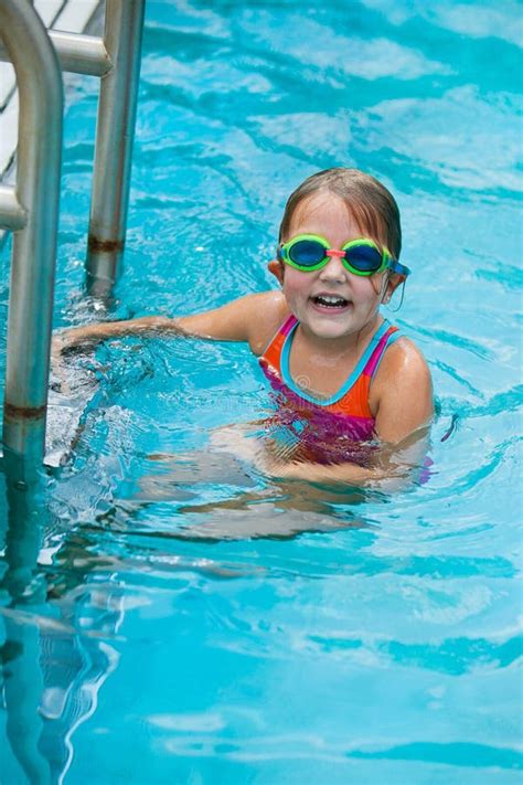 Little Girl Taking a Break during Swimming Swim Lessons at the Local ...