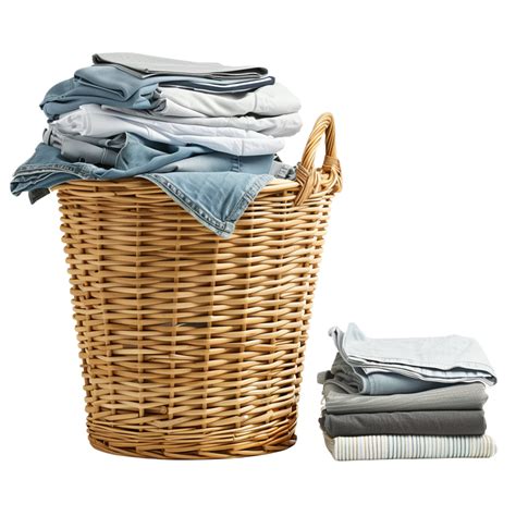 A Wicker Laundry Basket Overflowing With Clean Clothes Next To A Stack