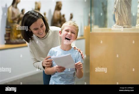 Family exploring artworks in museum Stock Photo - Alamy