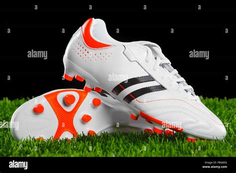 Soccer shoes on the green grass Stock Photo - Alamy