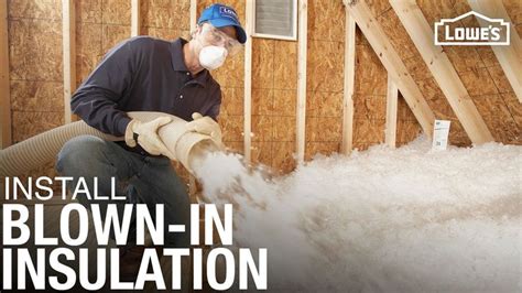 A Man Is Spraying Foam On The Insulation In His House With Words