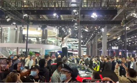 Woman Who Protested On Top Of A Tesla At Auto Shanghai 2021 Loses