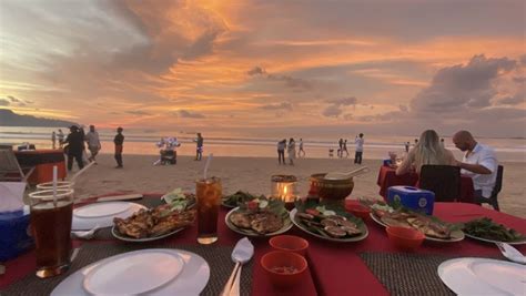muaya beach jimbaran savoring honey clams  grilled fish