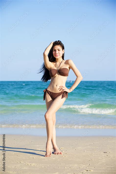 Beautiful Woman In Bikini On The Beach At Summer Day Stock Photo Adobe Stock