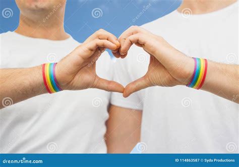 Gay Couple With Rainbow Wristbands And Hand Heart Stock Image Image