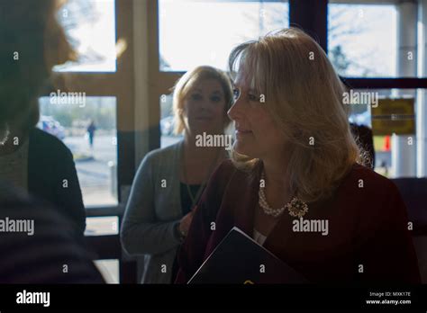 Mrs. Hollyanne Milley greets participants before the beginning of the Army Family Programs ...