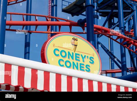 The Coneys Cones Ice Cream Shop Against Thunderbolt Roller Coaster