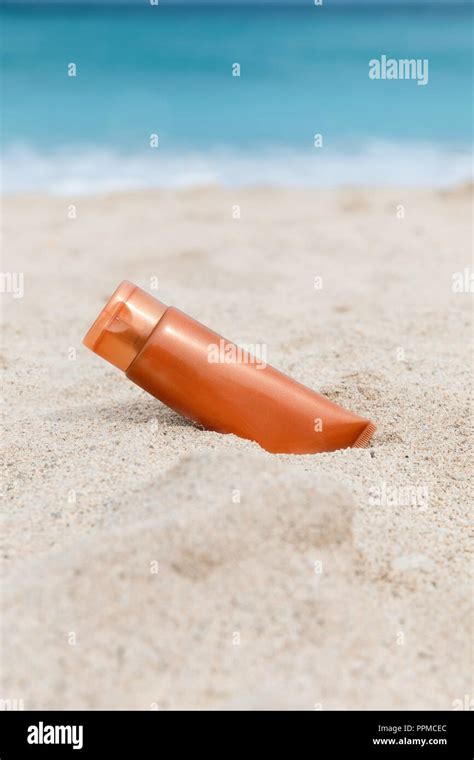 Sunscreen Sunblock Spf Cream On The Sea Beach Sand Summer Tropical