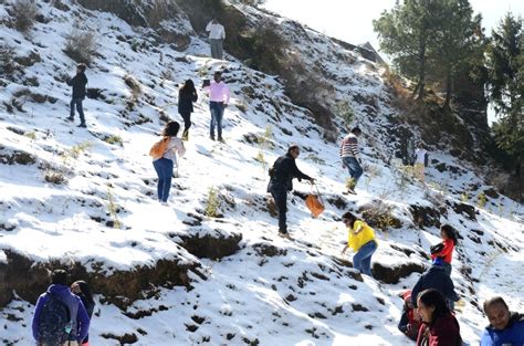 Tourists enjoy after Kufri receives the season's first snowfall