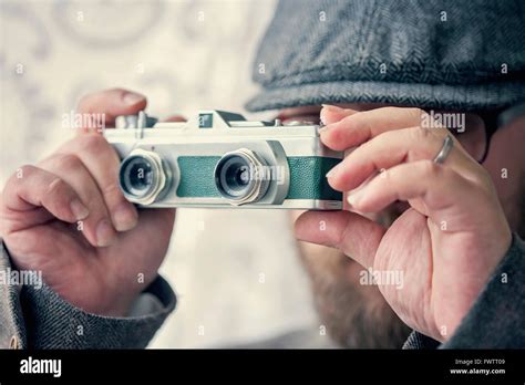 Stylish Photographer with old school vintage camera Stock Photo - Alamy