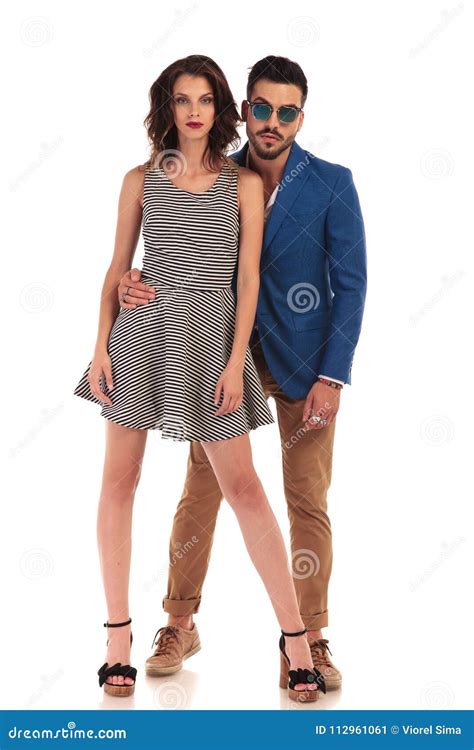 Attractive Couple Posing Together With Man Holding Woman`s Waist Stock