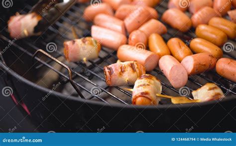 Sausages Wrapped In Bacon Fried On The Tray Sausages Wrapped In Bacon