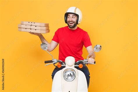 Delivery man in helmet red t-shirt uniform driving moped motorbike ...