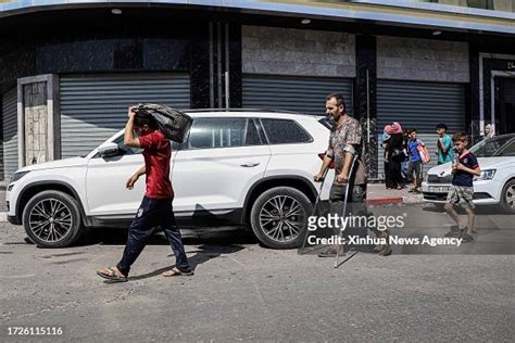 Palestinians flee their homes in Gaza City, on Oct. 13, 2023. Israeli ...