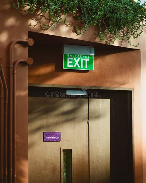 Green Emergency Exit Sign Above a Door Stock Image - Image of word ...