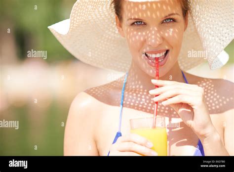 Portrait Of A Woman In Bikini Drinking Juice Stock Photo Alamy