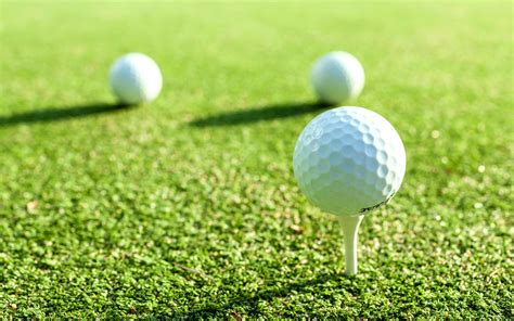 Golf balls on tees 2076693 Stock Photo at Vecteezy