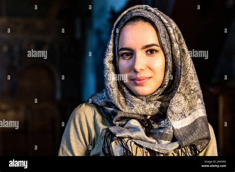 A bueatiful girl in a headscarf in an orthodox moanstery in Romania Stock Photo - Alamy