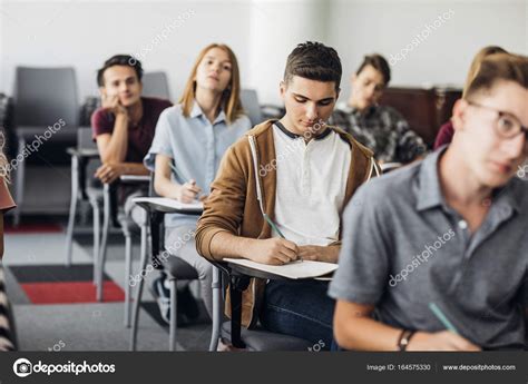 High School Students Sitting At Classroom — Stock Photo © Luminastock