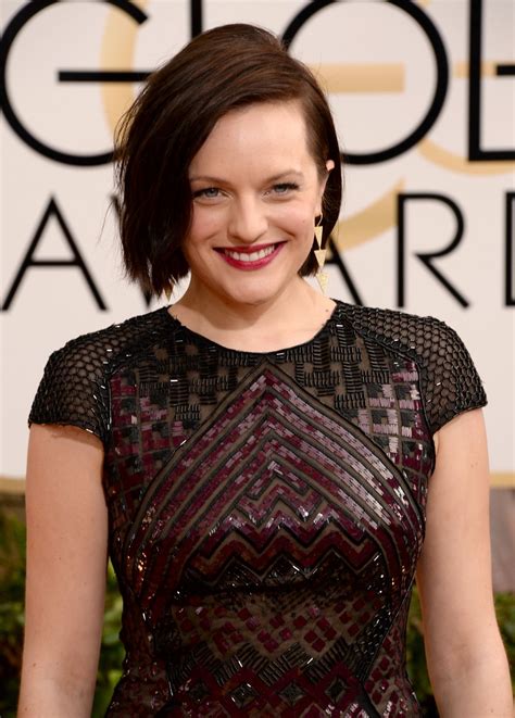 ELISABETH MOSS at 71st Annual Golden Globe Awards – HawtCelebs