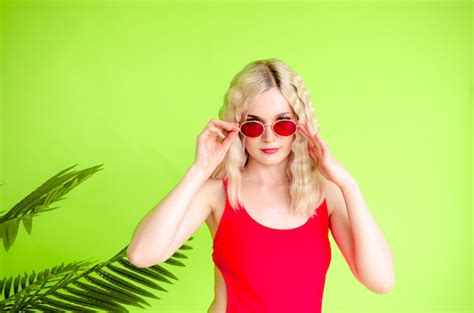 Premium Photo Portrait Of Beautiful Blonde Girl In Sunglasses And Red Swimsuit
