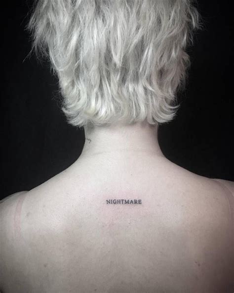 “Nightmare” tattoo on Halsey's upper back. | Tattoo nightmares, Halsey, Tattoos