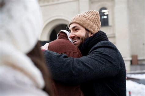 Free Photo Friends Reuniting And Hugging After Not Seeing Each Other