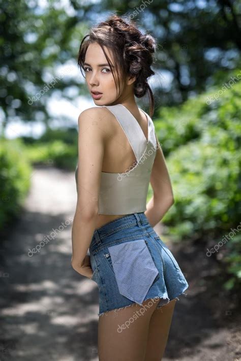 Girl in denim shorts Stock Photo by ©bezikus 114991918