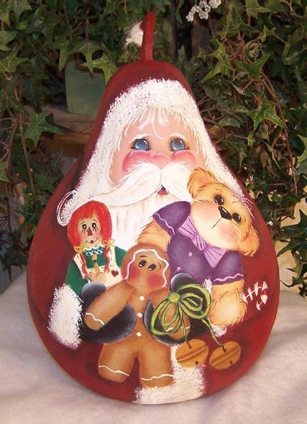 To make Christmas ornament gourd birdhouses, Decorating gourds with ...