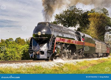 View of a Steam Passenger Train Approaching, Traveling Thru Rural ...